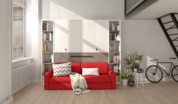 Cama abatible horizontal con armario superior y sofá . Librerías laterlaes